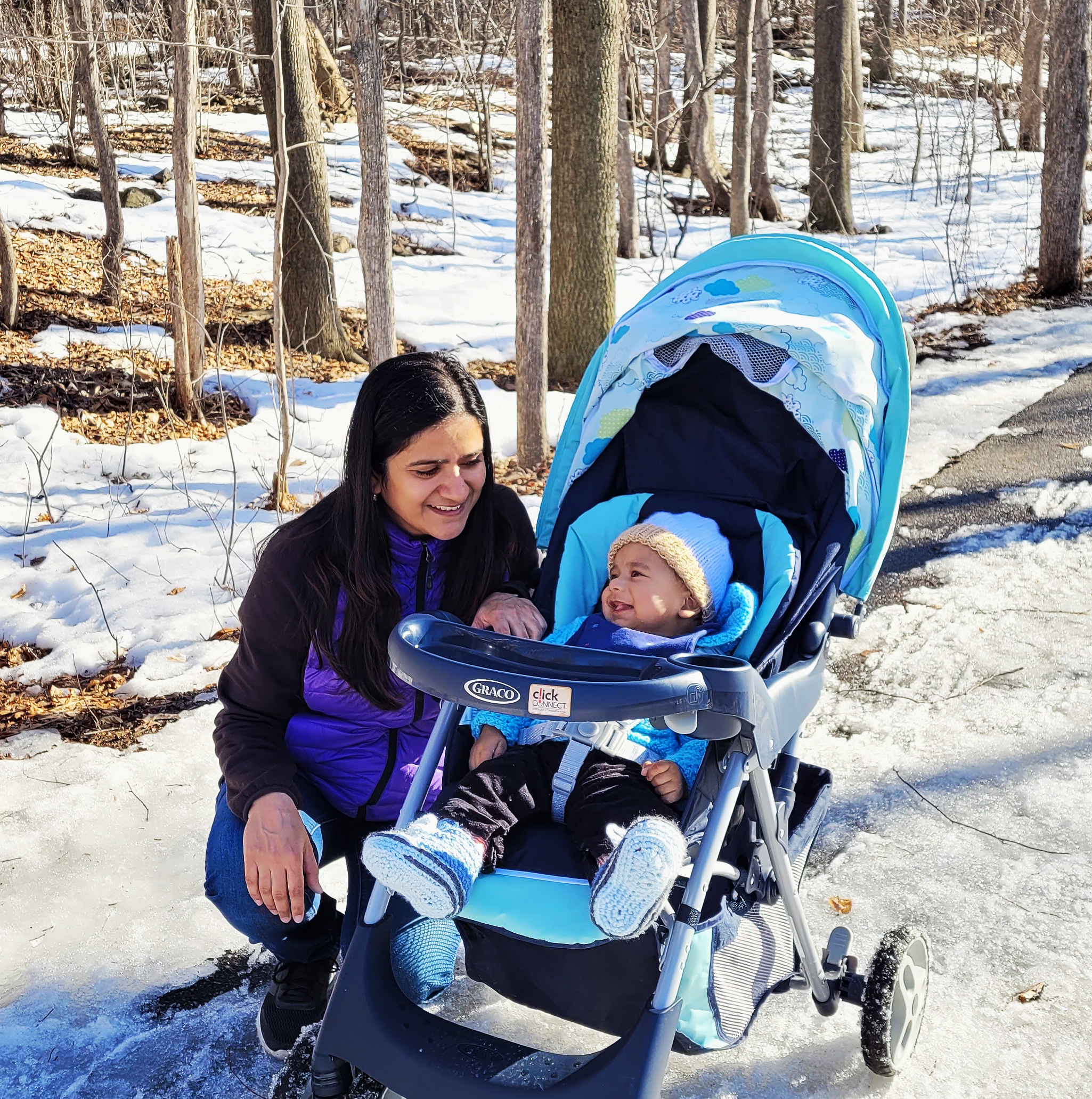 Prachi and her baby on a snowy trail