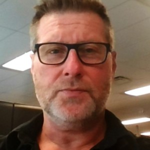 Mark McFadden headshot in office