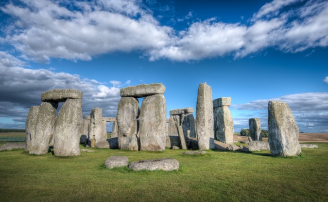 Stonehenge underneath a blue sky.
