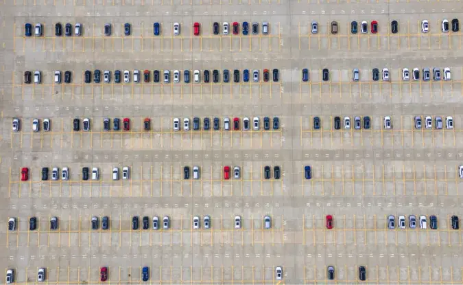 Aerial view of a car sales lot with lots of empty spaces