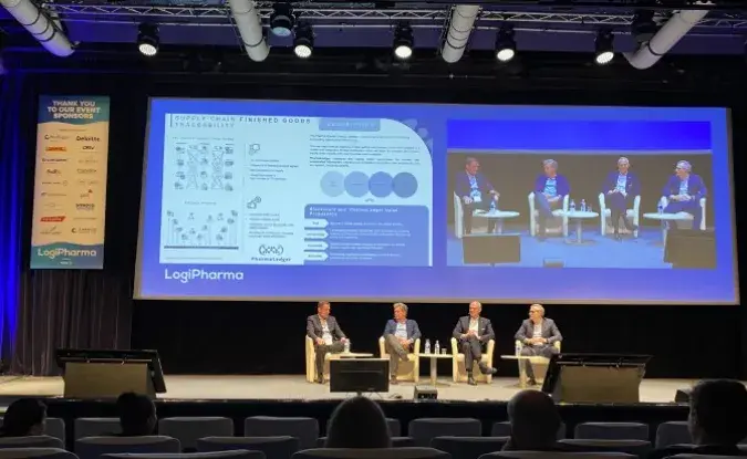A panel of four presenters onstage at Logipharma Europe in front of a Logipharma branded background.