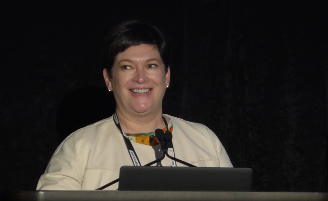 Portrait of Maria Rey-Marston, Accenture's Global Supply Chain Innovation Leader, presenting on stage at Kinexions '22.