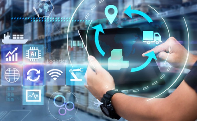 Man hands using tablet on blurred warehouse as background