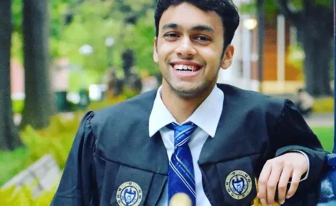 Professional photo of Kinaxis Co-Op/Intern Anirudh Thatavarty wearinguniversity graduation robes