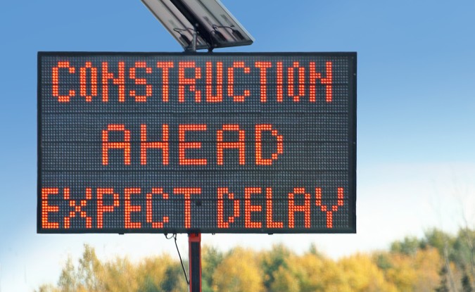 Road sign reading, "Construction ahead. Expect delays."