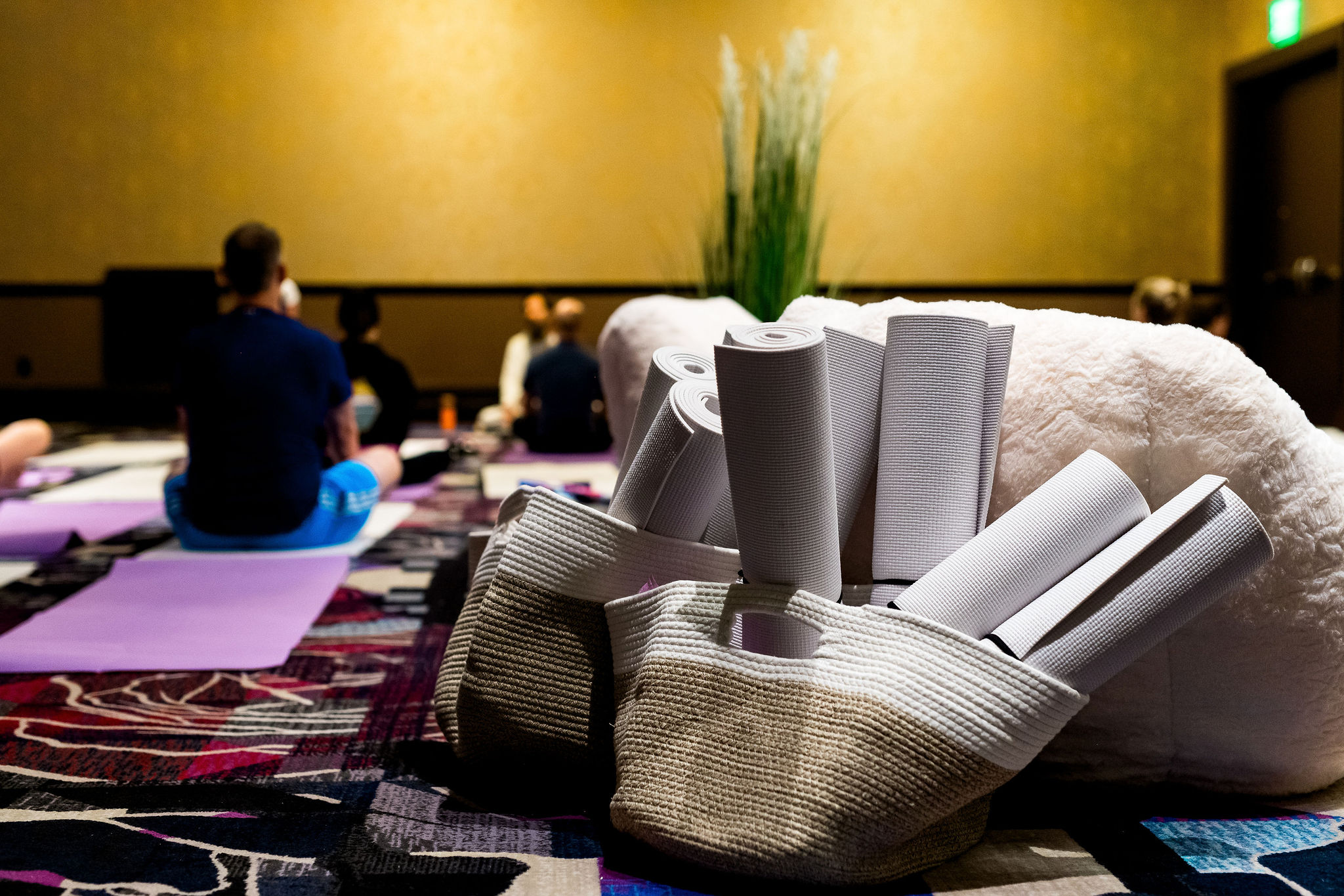 A Kinexions attendee attends a morning yoga sessions